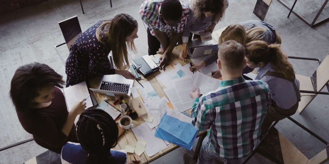 Business meeting at modern office top view of multiracial group of people working near the table together 681734914 5a9c080830371300361c7c27.jpg