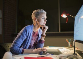 Graphic designer working late at computer in office 536908011 57bd142c3df78c87637a1d24.jpg