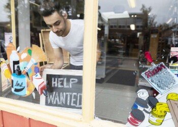 Male business owner placing help wanted sign in art supply shop window 1063781034 a98a24e42bc943e9872ccbe9f4328fa0.jpg