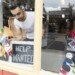 Male business owner placing help wanted sign in art supply shop window 1063781034 a98a24e42bc943e9872ccbe9f4328fa0.jpg