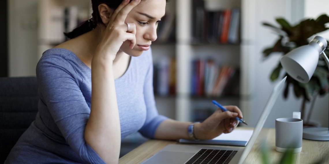 Worried young woman working on laptop at home 1221479965 5a1173eda99c4bc4828d24a62903195d.jpg